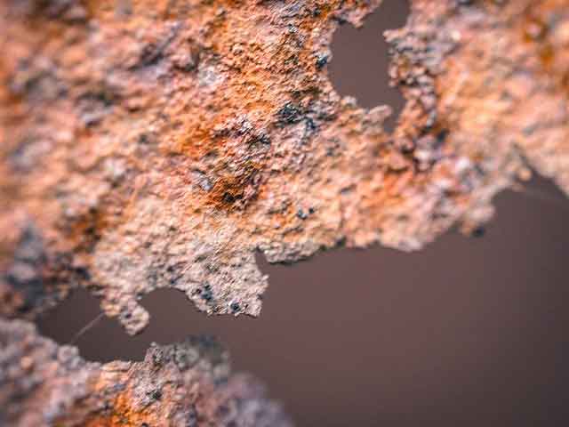 Badly corroded roof plates caused by trapped moisture from spray foam insulation