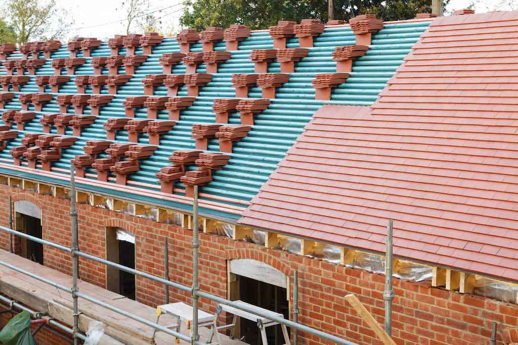 Trusted UK Roofers - tiling a residential roof